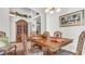 Dining room with wooden table, chairs, and a china cabinet at 1153 Legatto Loop, Dundee, FL 33838