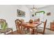 Dining room with a wooden table and tropical-themed chairs at 1153 Legatto Loop, Dundee, FL 33838