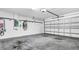 Clean and organized garage with overhead storage at 1153 Legatto Loop, Dundee, FL 33838
