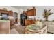 Kitchen features dark wood cabinets and a breakfast nook at 1153 Legatto Loop, Dundee, FL 33838
