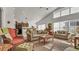 Open living room with vaulted ceilings and ample natural light at 1153 Legatto Loop, Dundee, FL 33838
