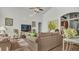 Living room with neutral decor and natural light at 1153 Legatto Loop, Dundee, FL 33838