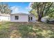 House with a spacious backyard and large trees at 124 A St, Haines City, FL 33844