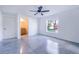 Bedroom with ensuite bathroom and concrete floors at 124 A St, Haines City, FL 33844