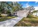 Newly built home with a landscaped yard and driveway at 124 A St, Haines City, FL 33844