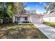 Newly built home with a landscaped yard and driveway at 124 A St, Haines City, FL 33844