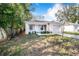 Newly built home with a landscaped yard and driveway at 124 A St, Haines City, FL 33844