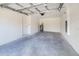 Spacious garage with concrete floor and water heater at 124 A St, Haines City, FL 33844