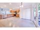 Modern kitchen featuring wood cabinets, stainless steel appliances, and concrete floors at 124 A St, Haines City, FL 33844