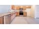 Modern kitchen featuring stainless steel appliances and light wood cabinets at 124 A St, Haines City, FL 33844