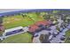 Aerial view of the golf course, clubhouse, and parking lot at 1932 Southern Dunes Blvd, Haines City, FL 33844