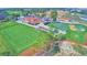 Aerial view of the golf course, clubhouse, and driving range at 1932 Southern Dunes Blvd, Haines City, FL 33844