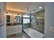Modern bathroom with double vanity and large shower at 1932 Southern Dunes Blvd, Haines City, FL 33844