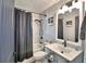 Bathroom with shower/tub combo and modern vanity at 1932 Southern Dunes Blvd, Haines City, FL 33844