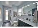 Modern bathroom with updated vanity, frameless shower, and gray walls at 1932 Southern Dunes Blvd, Haines City, FL 33844