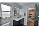 Modern bathroom with updated vanity, frameless shower, and gray walls at 1932 Southern Dunes Blvd, Haines City, FL 33844