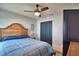 Bedroom with double doors and ceiling fan at 1932 Southern Dunes Blvd, Haines City, FL 33844