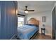 Bedroom with a wooden bed frame and blue bedding at 1932 Southern Dunes Blvd, Haines City, FL 33844