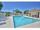 Smaller community pool with lounge chairs and cabana at 1932 Southern Dunes Blvd, Haines City, FL 33844