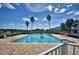 Large community pool with surrounding lounge chairs at 1932 Southern Dunes Blvd, Haines City, FL 33844