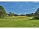 Scenic view of a lush green golf course at 1932 Southern Dunes Blvd, Haines City, FL 33844