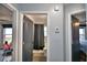 Hallway view with doors to bedroom and bathroom at 1932 Southern Dunes Blvd, Haines City, FL 33844