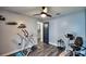 Bright home gym with exercise equipment and wood-look flooring at 1932 Southern Dunes Blvd, Haines City, FL 33844