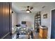 Home office with glass-top desk, shelving, and ceiling fan at 1932 Southern Dunes Blvd, Haines City, FL 33844