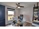 Home office with glass-top desk, shelving, and ceiling fan at 1932 Southern Dunes Blvd, Haines City, FL 33844