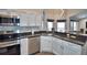 Modern kitchen with stainless steel appliances and white cabinets at 1932 Southern Dunes Blvd, Haines City, FL 33844