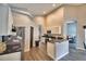 Spacious kitchen with stainless steel appliances and an island at 1932 Southern Dunes Blvd, Haines City, FL 33844