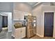 Modern kitchen with stainless steel appliances and white cabinets at 1932 Southern Dunes Blvd, Haines City, FL 33844