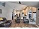 Open concept living area with hardwood floors and kitchen access at 1932 Southern Dunes Blvd, Haines City, FL 33844