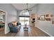 Living room with pool view, leather couch, and access to bedroom at 1932 Southern Dunes Blvd, Haines City, FL 33844