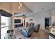 Spacious living area with vaulted ceiling,recliner chairs, and large TV at 1932 Southern Dunes Blvd, Haines City, FL 33844