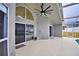 Spacious patio with access to pool and sliding glass doors at 1932 Southern Dunes Blvd, Haines City, FL 33844