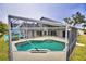 Screened-in pool with large patio area at 1932 Southern Dunes Blvd, Haines City, FL 33844