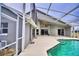 Inviting pool area with screened enclosure and patio at 1932 Southern Dunes Blvd, Haines City, FL 33844