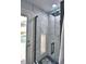 Modern shower with marble tile and glass enclosure at 1932 Southern Dunes Blvd, Haines City, FL 33844