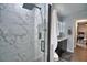 Large shower with marble tile and glass door at 1932 Southern Dunes Blvd, Haines City, FL 33844