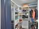 Spacious walk-in closet with custom shelving at 1932 Southern Dunes Blvd, Haines City, FL 33844