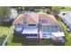 House with a pool, spa, and screened enclosure in the backyard at 2119 Kirkland Lake Dr, Auburndale, FL 33823