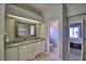 Bathroom with double vanity, separate toilet, and views to bedroom at 2119 Kirkland Lake Dr, Auburndale, FL 33823