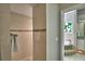 Elegant bathroom with a shower, soaking tub, and stained glass window at 2119 Kirkland Lake Dr, Auburndale, FL 33823