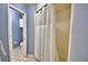 Bathroom with shower/tub combo and tiled walls at 2119 Kirkland Lake Dr, Auburndale, FL 33823