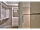 Clean bathroom with walk-in shower and closet storage at 2119 Kirkland Lake Dr, Auburndale, FL 33823