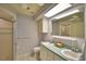 Bathroom with double vanity and shower stall at 2119 Kirkland Lake Dr, Auburndale, FL 33823
