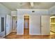 Bedroom with two doors and hardwood floors at 2119 Kirkland Lake Dr, Auburndale, FL 33823
