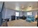 Multipurpose bedroom with a desk setup, couch, and large TV at 2119 Kirkland Lake Dr, Auburndale, FL 33823