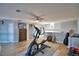 Bright bonus room featuring hardwood floors and home gym equipment at 2119 Kirkland Lake Dr, Auburndale, FL 33823